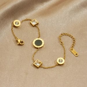 Elegant gold stainless steel bracelet with Roman numeral charms and sparkling crystals