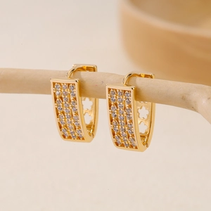 Elegant gold-plated geometric V-shape earrings with zircon micro-pave on wood stand