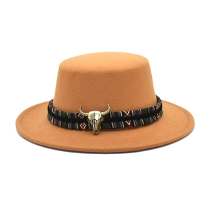 Detail of camel wool fedora with ethnic woven band and golden bull skull metal buckle