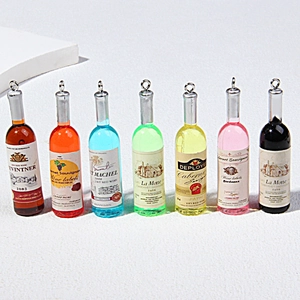 Set of seven colorful miniature resin wine bottle pendants with silver hanging rings