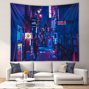 Detailed view of cyberpunk city street tapestry hanging above a modern white sofa
