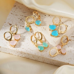 Elegant gold drop earrings with heart and teardrop stones in pink, blue, and mint green