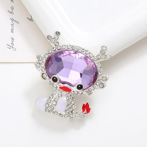 Macro detail of a silver cartoon dragon charm with purple crystal and clear rhinestones