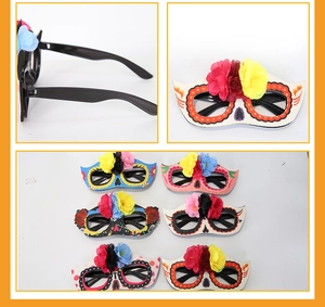 Detail of 6 Day of the Dead party glasses with glitter paper frames and silk flowers