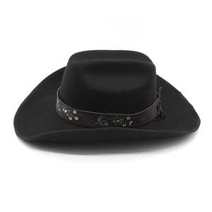 Vintage black felt cowboy hat with embroidered floral leather band on white background