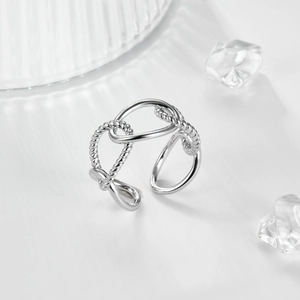 Detail of S925 sterling silver interlocking rings with rope texture and adjustable band