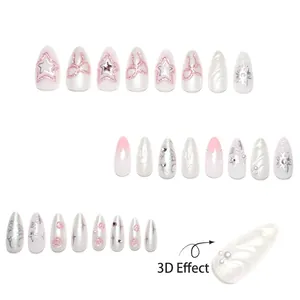 3D star press-on nails with pink glitter and bow accents in almond shape design