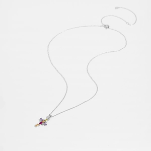 Close-up of S925 sterling silver chain with a colorful gemstone cross pendant on white back