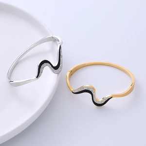 Titanium steel wave bracelets in gold and silver with white zircons and black texture
