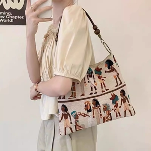 Vintage Egyptian jacquard canvas tote bag with wooden beads on model for casual wear