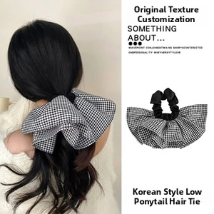 Detail of the black and white gingham lace embroidery bow hair claw clip accessory