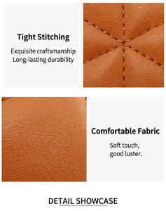 Macro shot of brown lychee leather texture with precise crisscross stitching and soft fabric