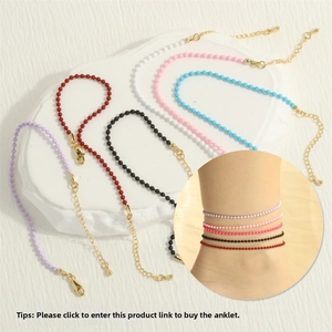 Detail of colorful beaded anklet set featuring adjustable gold clasps and extender chains