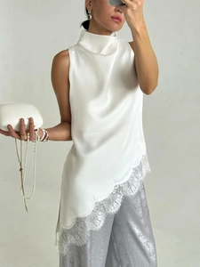 Elegant white satin sleeveless top with lace trim and irregular hem for summer