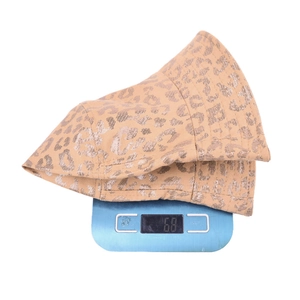 Leopard print bucket hat weighing 68g on a digital scale for material weight reference