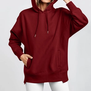 Detailed view of burgundy hoodie featuring adjustable drawstrings and a spacious pocket