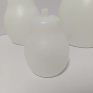Close-up of translucent pear-shaped plastic ornaments for DIY Christmas light accessories