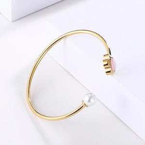 Minimalist gold open cuff bracelet with white pearl and pink floral crystal accent