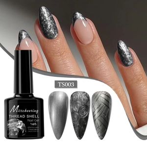 Macro detail of silver pearl shell thread nail gel showing textured brush patterns