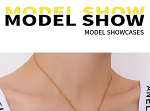Close-up of a minimalist 18k gold plated wing pendant necklace worn on a model's neck