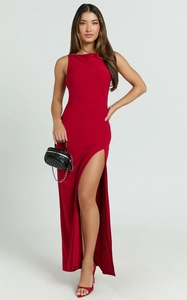 Detail view of red sleeveless maxi dress featuring a high side slit and slim fit silhouette