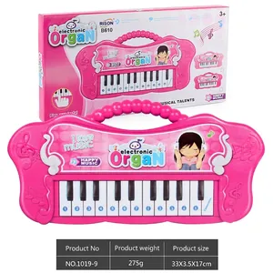 Detailed macro view of pink electronic toy piano keys with numbers and cartoon graphics