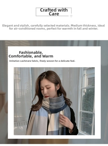 Close-up of soft cashmere-like fabric scarf with blue and beige plaid pattern