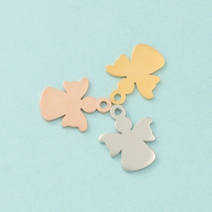 Three polished angel pendants in gold, rose gold, and silver finishes for DIY jewelry