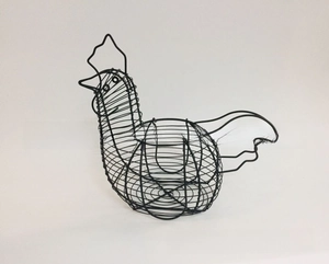 Detail of chicken-shaped black wire egg basket showing woven metal and open back design