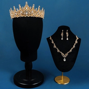 Exquisite bridal jewelry set with golden crystal crown, necklace, and earrings detail