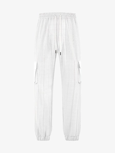 Detail of white cargo pants featuring elastic drawstring waist and textured grid fabric