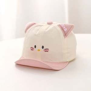 Close-up of baby sun hat featuring embroidered cat face and soft 3D ears with pink bow