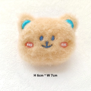 Cute brown plush bear brooch with embroidered details, measuring 6cm by 7cm wide