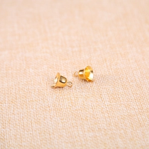 Pair of golden Christmas bell pendants for DIY jewelry and festive tree decorations