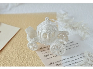 Detailed view of white glitter pumpkin carriage ornament with ribbon for Christmas tree
