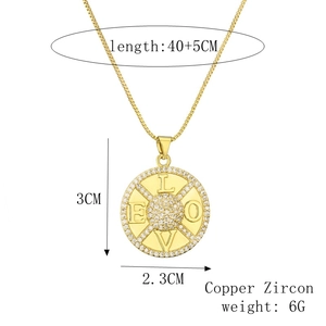 Detail view of gold moon and stars pendant necklace with LOVE text and dimensions