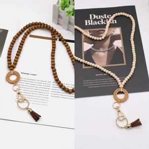 Boho wood bead lanyard with woven ring and tassel detail in beige and brown tones