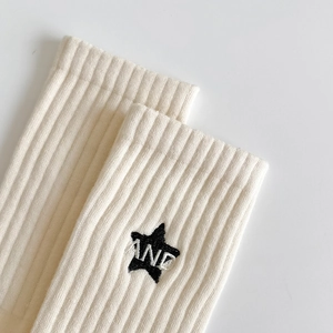 Striped cotton crew socks with cream ribbed cuffs and black star letter embroidery
