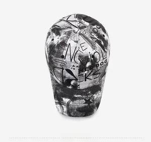 Top view of a streetwear baseball cap featuring black and white abstract graffiti prints