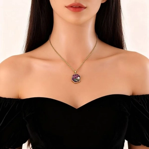 Golden necklace with purple enamel heart flower pendant and pearl on female model