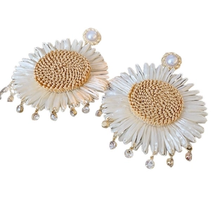 Bohemian sunflower woven earrings with white beads, pearls and small rhinestone pendants