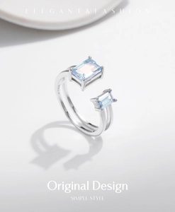 Macro detail of S925 silver hallmarks on a double-layer ring with blue gemstones
