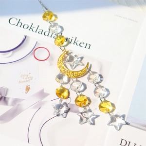 Bohemian crystal suncatcher with golden crescent moon and sparkling star prisms