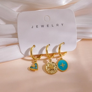 Detail of 14K gold plated earrings with blue stone heart and star pendants, weight 5.5g
