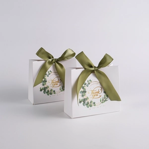 White forest eucalyptus gift box with green ribbon and golden Thank You print for weddings