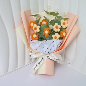 Handmade crochet puff flower bouquet with orange flowers and eucalyptus leaves
