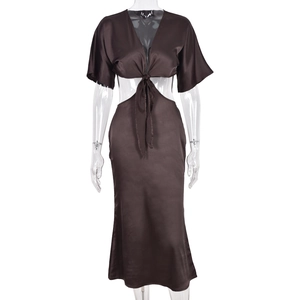 Detail of the brown silk dress showing deep V-neckline and waist tie-up cutout feature