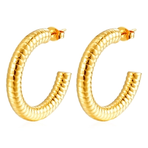 Detail of gold C-shaped earrings with unique texture and 18K vacuum plating finish