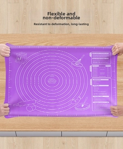 Close-up of flexible purple silicone baking mat showing measurement scales and durable texture
