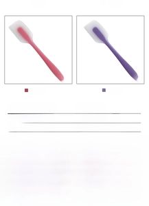 Detail of red and purple large silicone spatulas with translucent finish and hanging holes